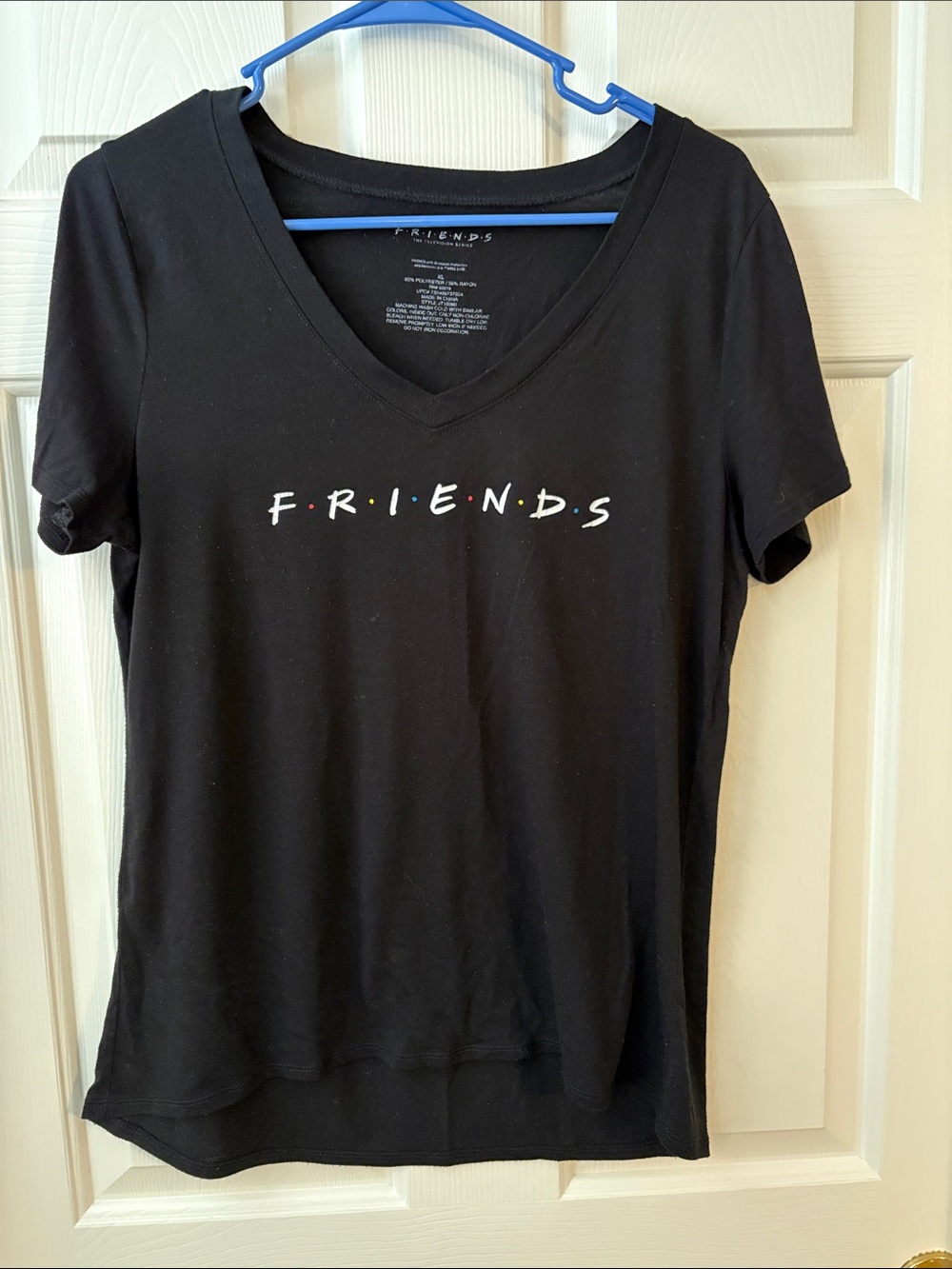 FRIENDS Black V-Neck Tee with Multicolor Dot Accents